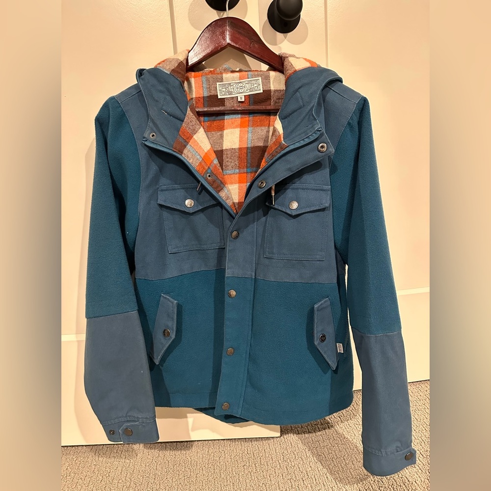 Poler coat, top is canvas and bottom fleece. Flannel lined